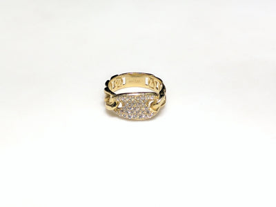In the center: a 10 karat yellow gold gucci link style lady's ring set with cubic zirconia in a micro pave setting laying flat facing viewer made by Lucky Diamond in New York City
