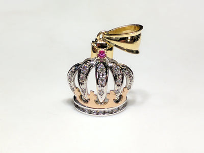 In the center: a 14K rose, white, and yellow gold king's crown pendant set with round and princess cut cubic zirconia standing front view made by Lucky Diamond