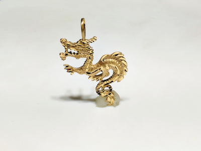 In the center: a 14 karat yellow gold diamond cut eastern asian dragon standing in frontal view - Lucky Diamond