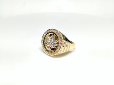 45 angle view of a 10 karat yellow gold signet ring with a white marijuana leaf embedded inside a bezel iced out with cubic zirconia - Lucky Diamond New York