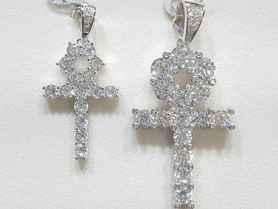 Two sterling silver ankh pendants side by side set with cubic zirconia in direct view - Lucky Diamond